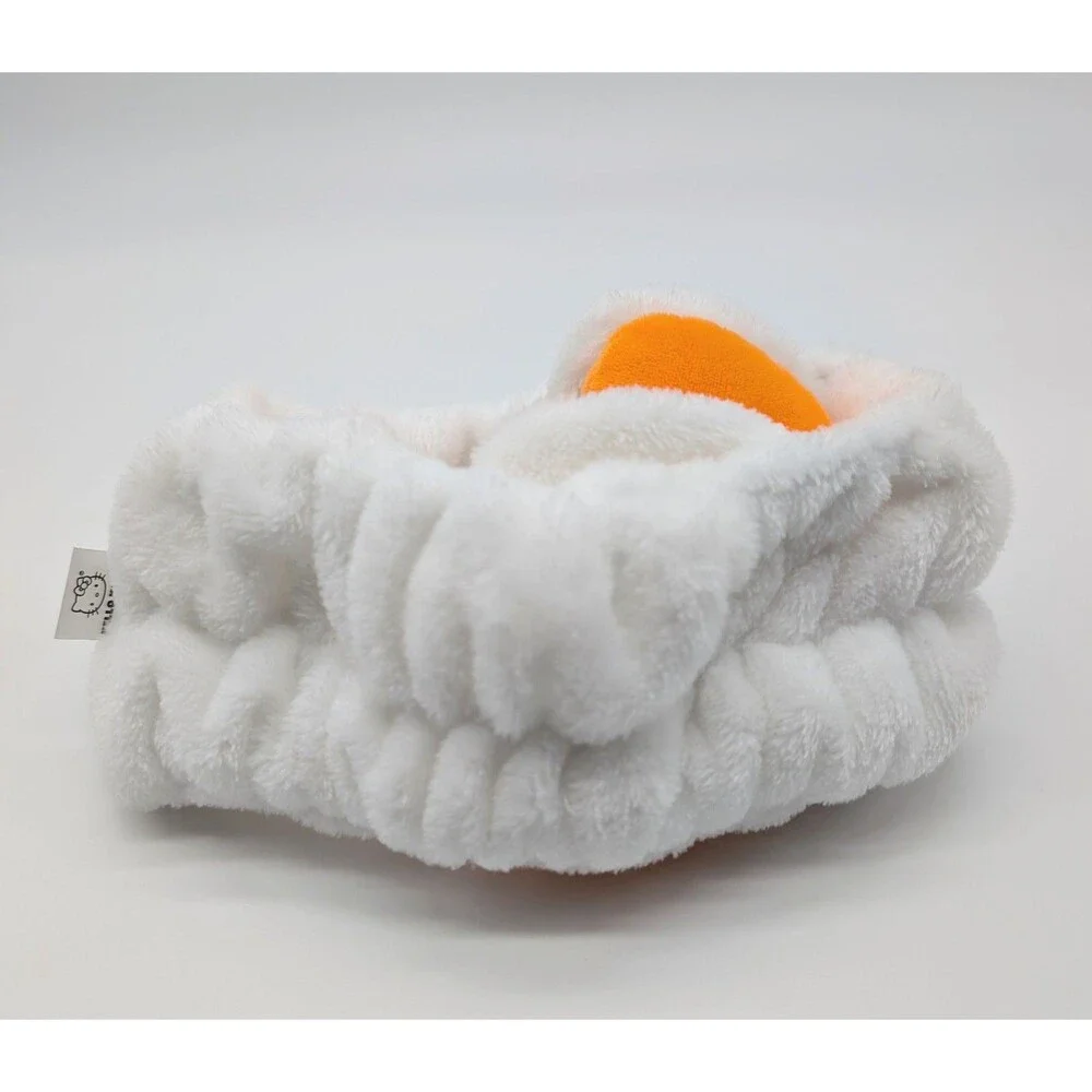 the CREME Hello Kitty Halloween Plush Spa Headband with Candy Corn Bow Limited